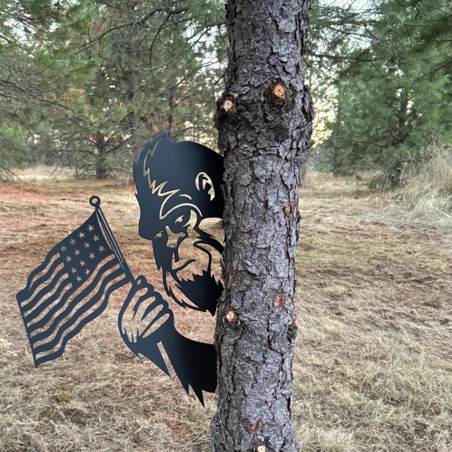 Bigfoot metal art showing middle finger