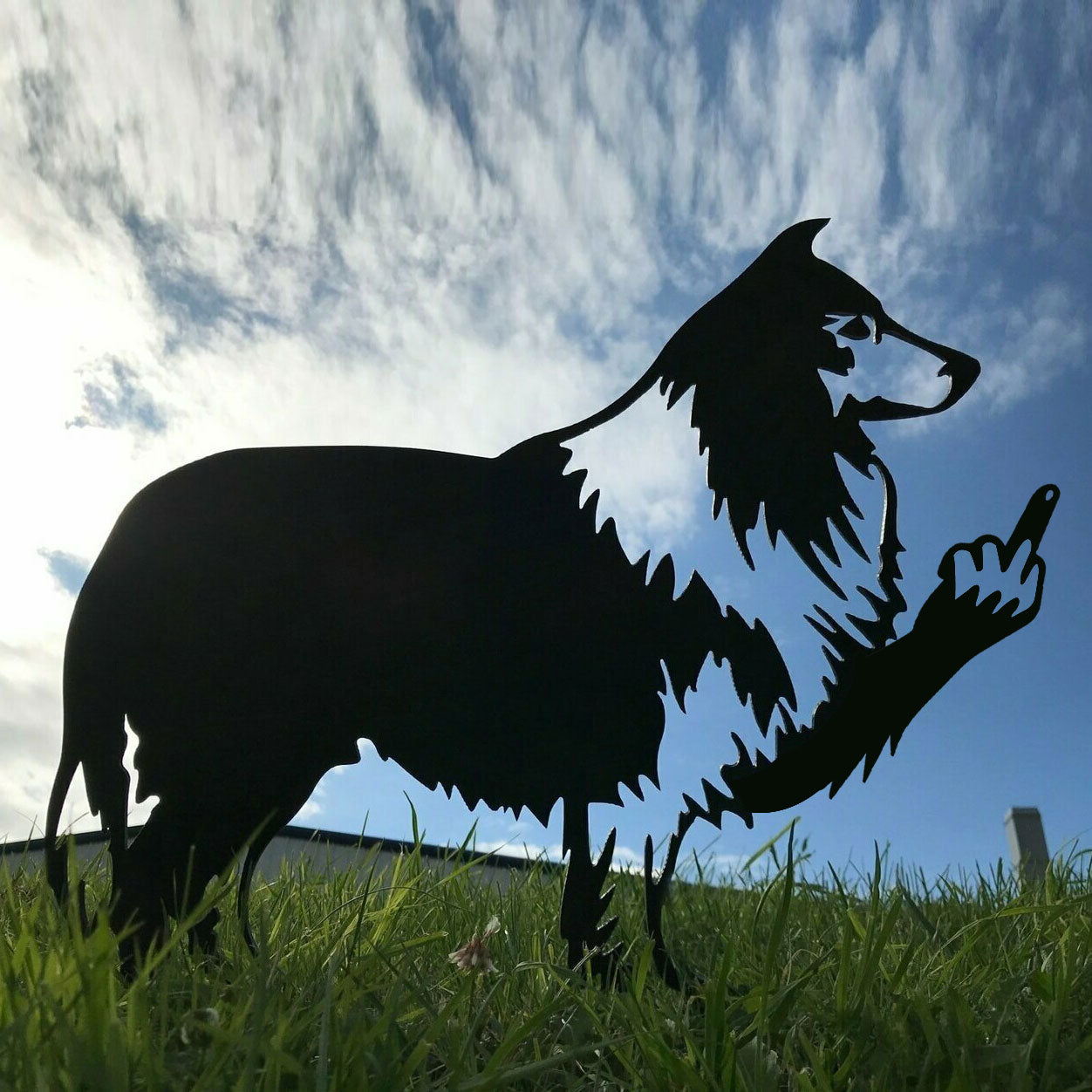 Dog metal art showing middle finger