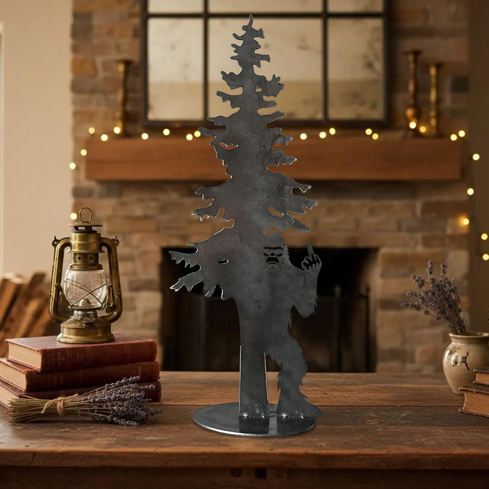 Bigfoot hiding behind an evergreen tree with his middle finger raised