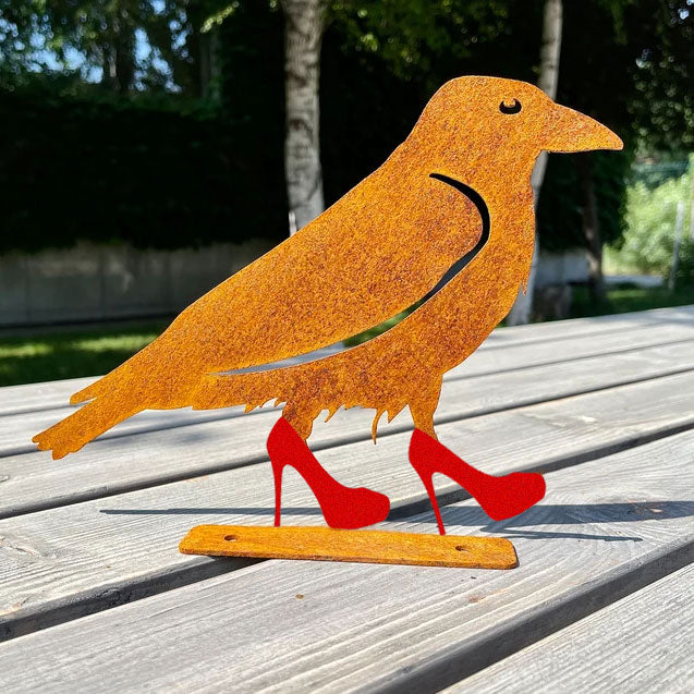 Crow wearing shoes metal art