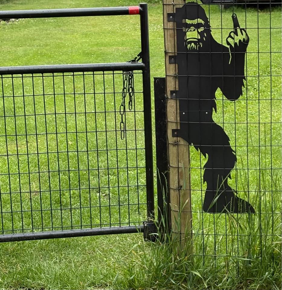 Bigfoot metal art showing middle finger