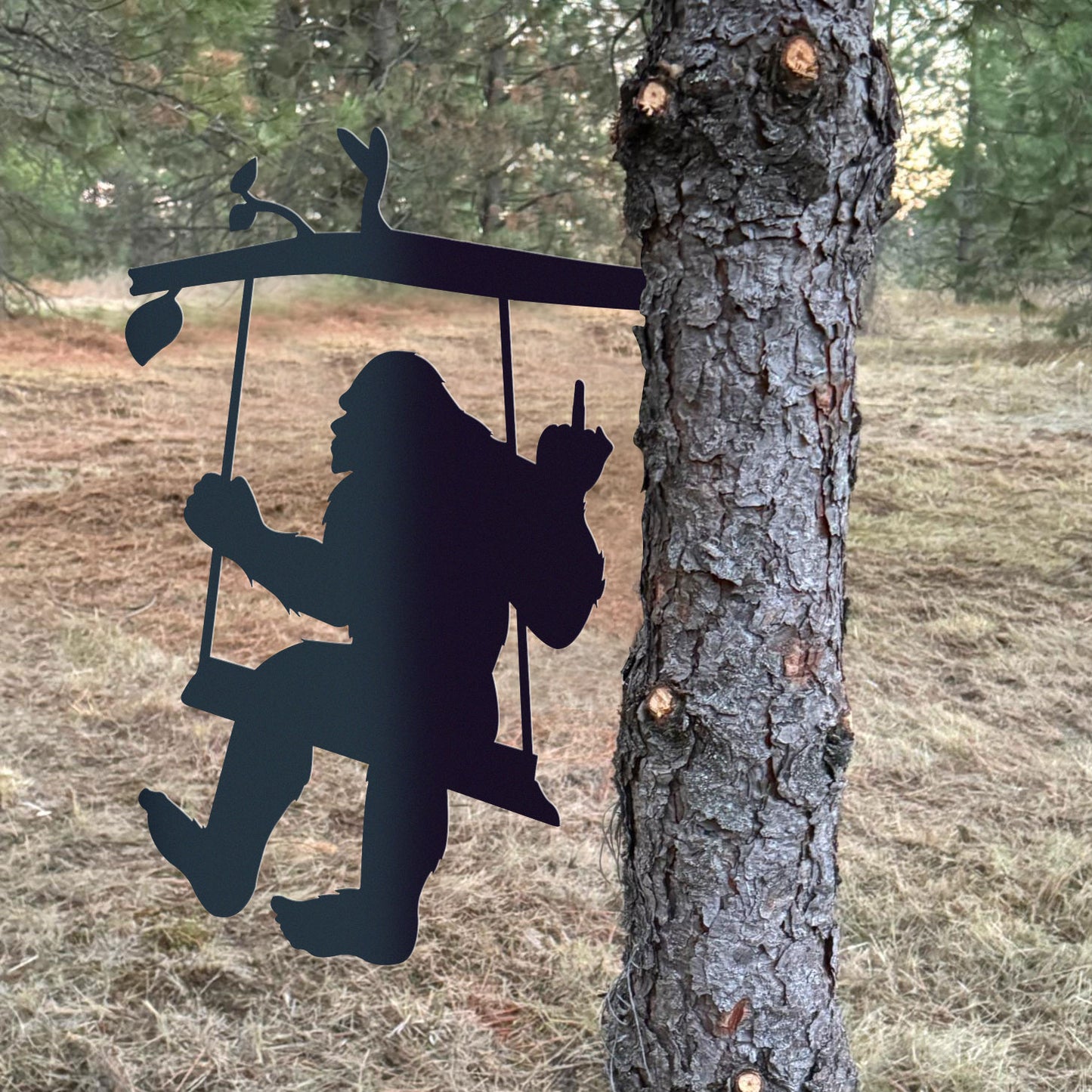 Bigfoot metal art on a swing