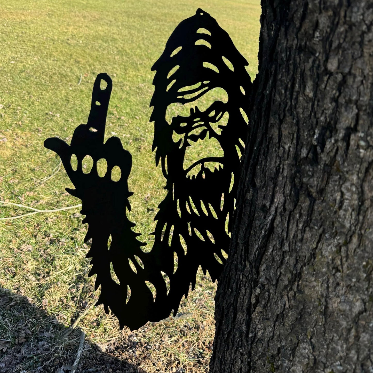 Bigfoot metal art showing middle finger