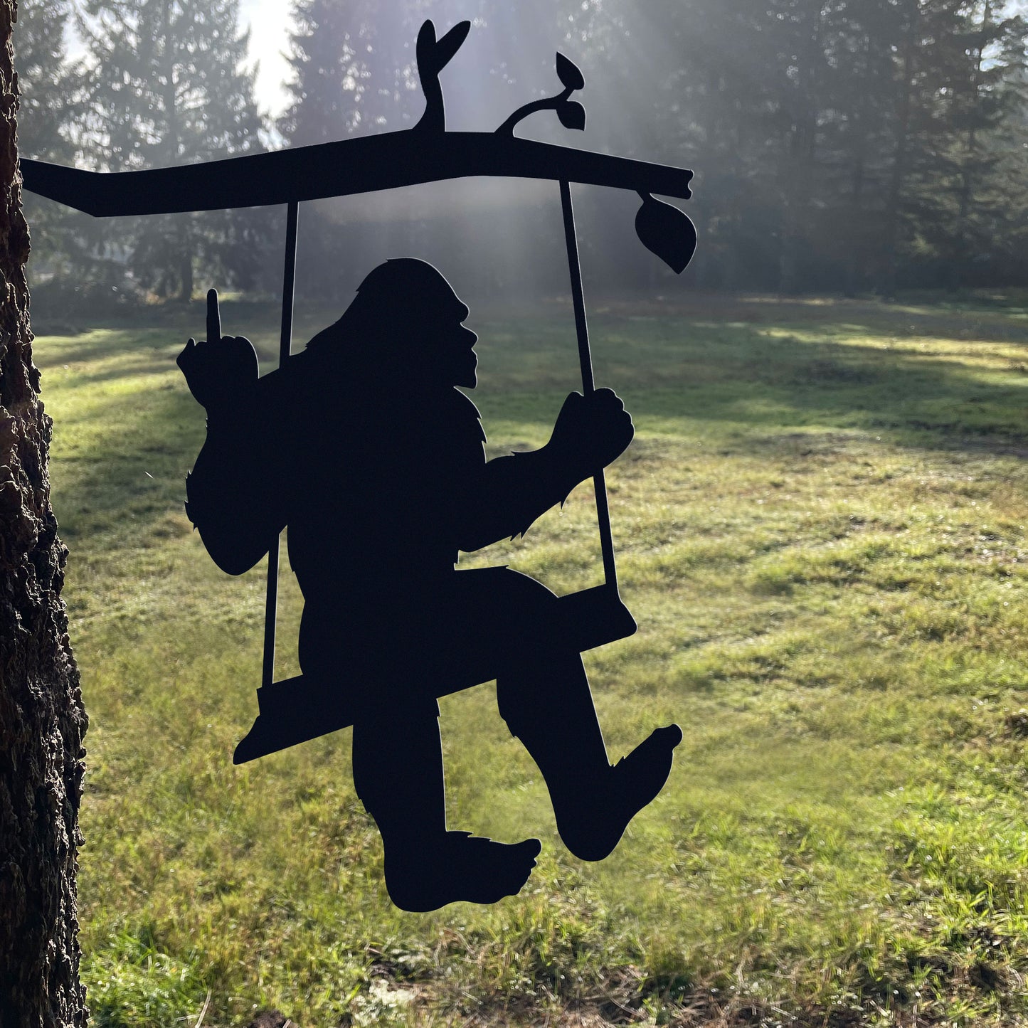 Bigfoot metal art on a swing
