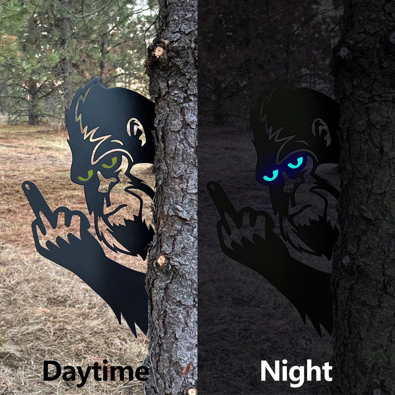 Bigfoot with glowing eyes, giving the middle finger metal art