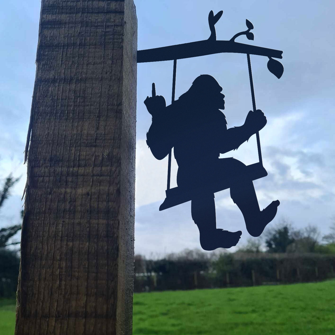Bigfoot metal art on a swing