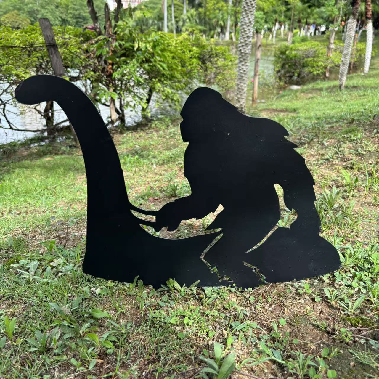 Bigfoot riding Loch Ness Monster metal art