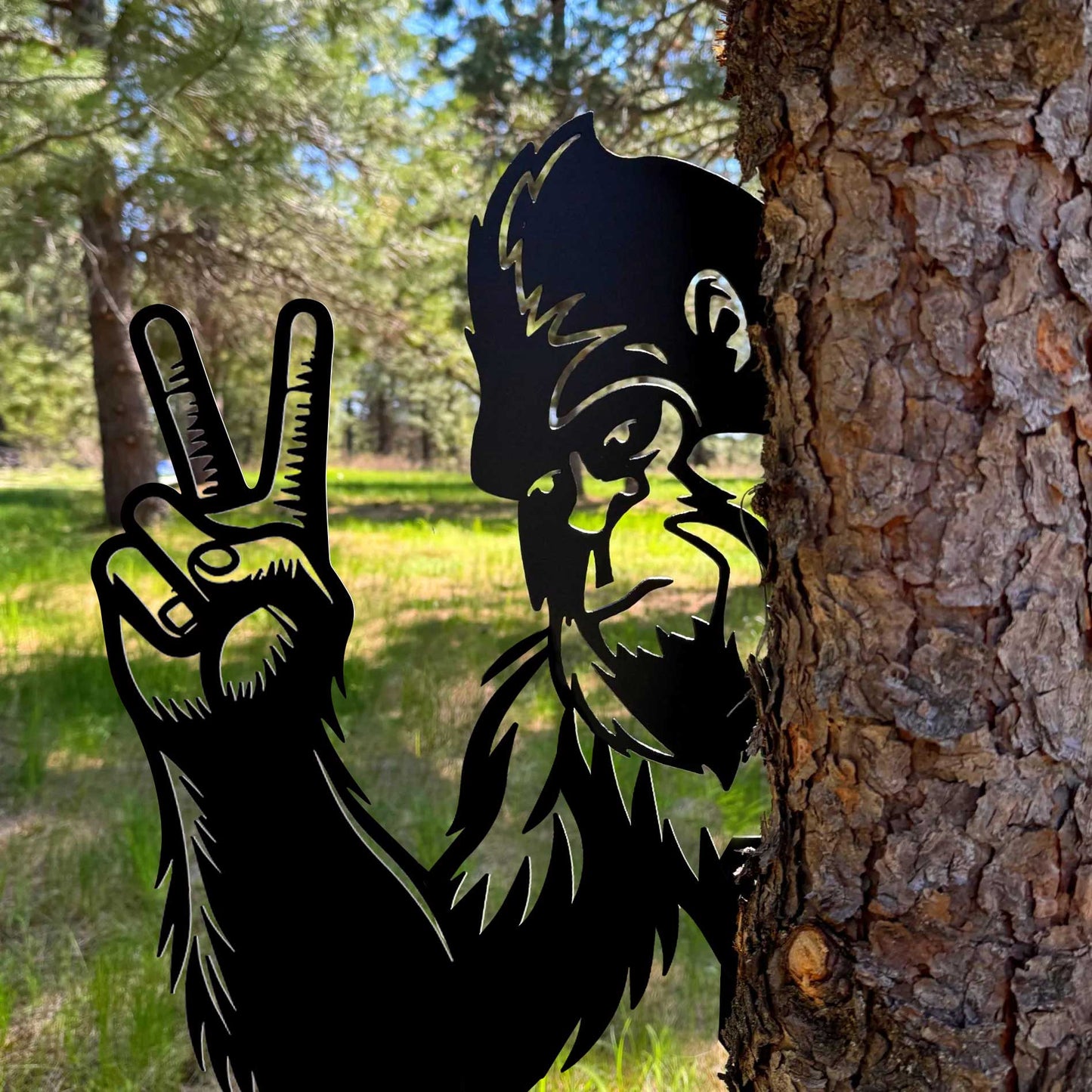 Bigfoot metal art showing middle finger