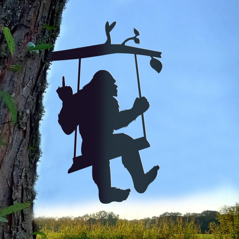 Bigfoot metal art on a swing