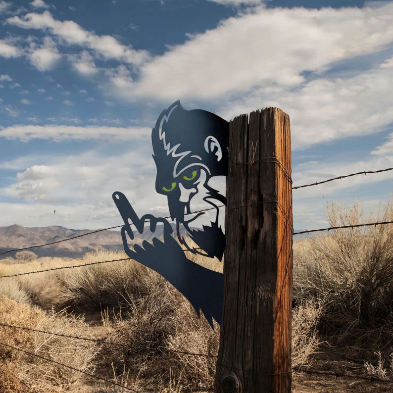 Bigfoot with glowing eyes, giving the middle finger metal art