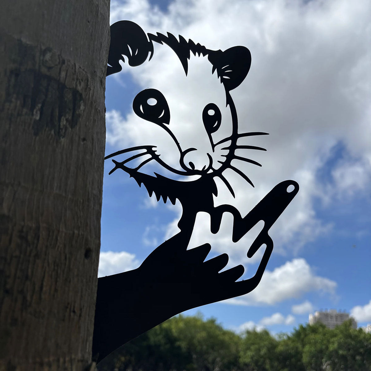 Animal metal art showing middle finger