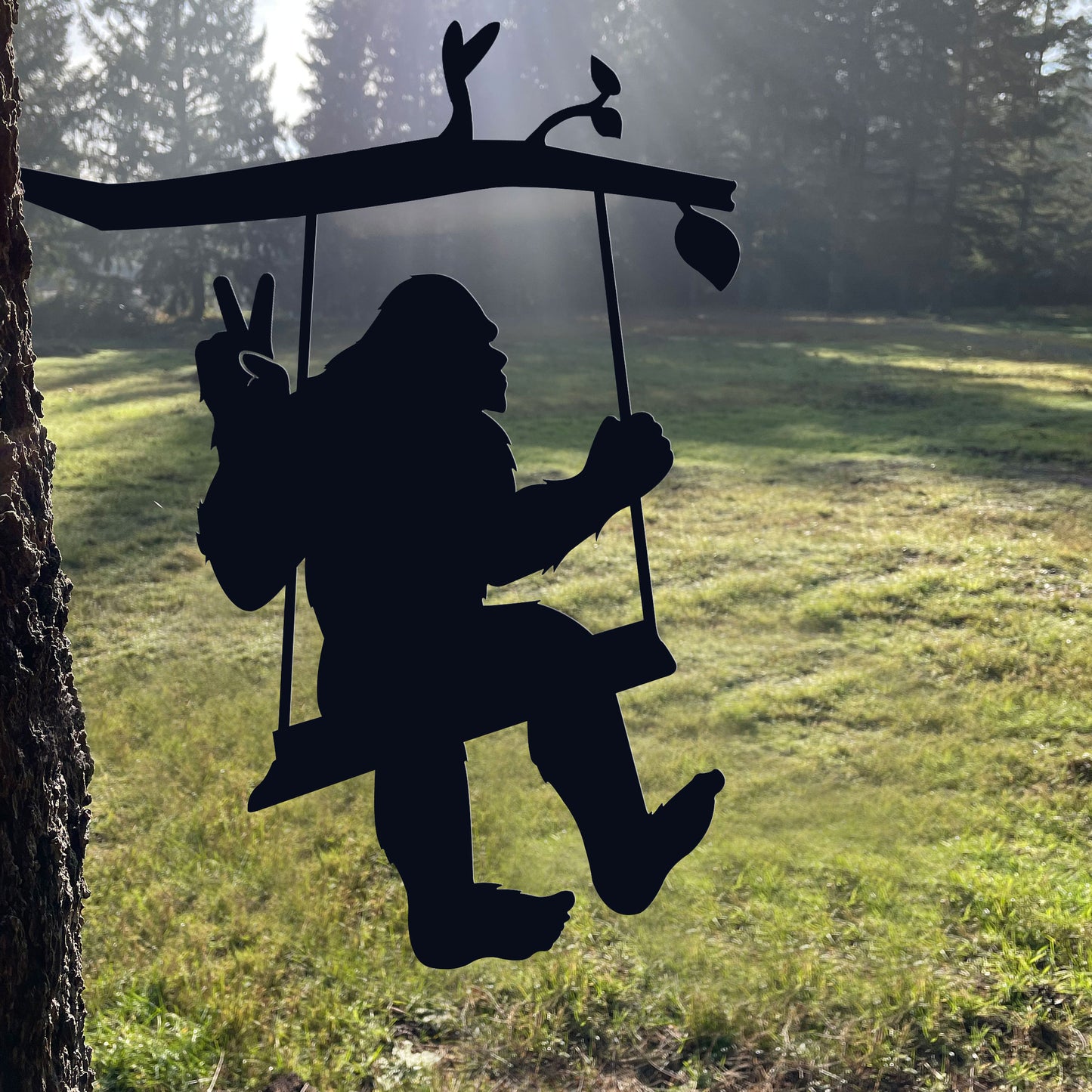 Bigfoot metal art on a swing