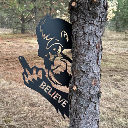 Bigfoot metal art showing middle finger