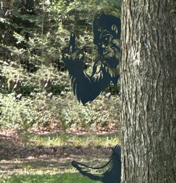 Metal Bigfoot giving the middle finger
