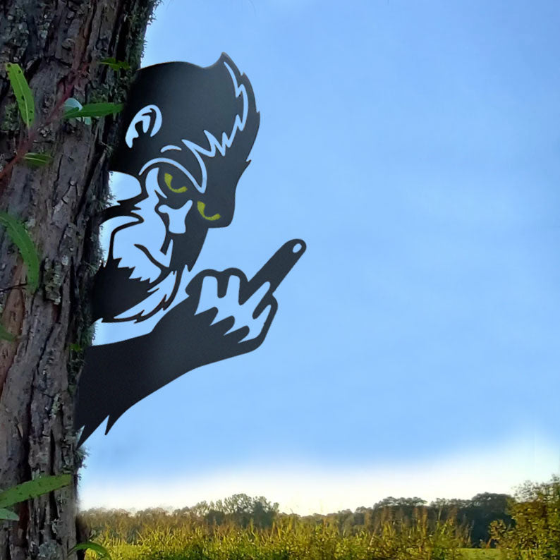 Bigfoot with glowing eyes, giving the middle finger metal art