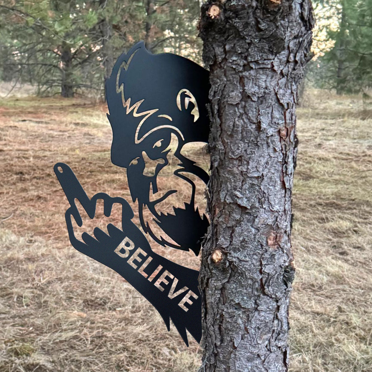 Bigfoot metal art showing middle finger