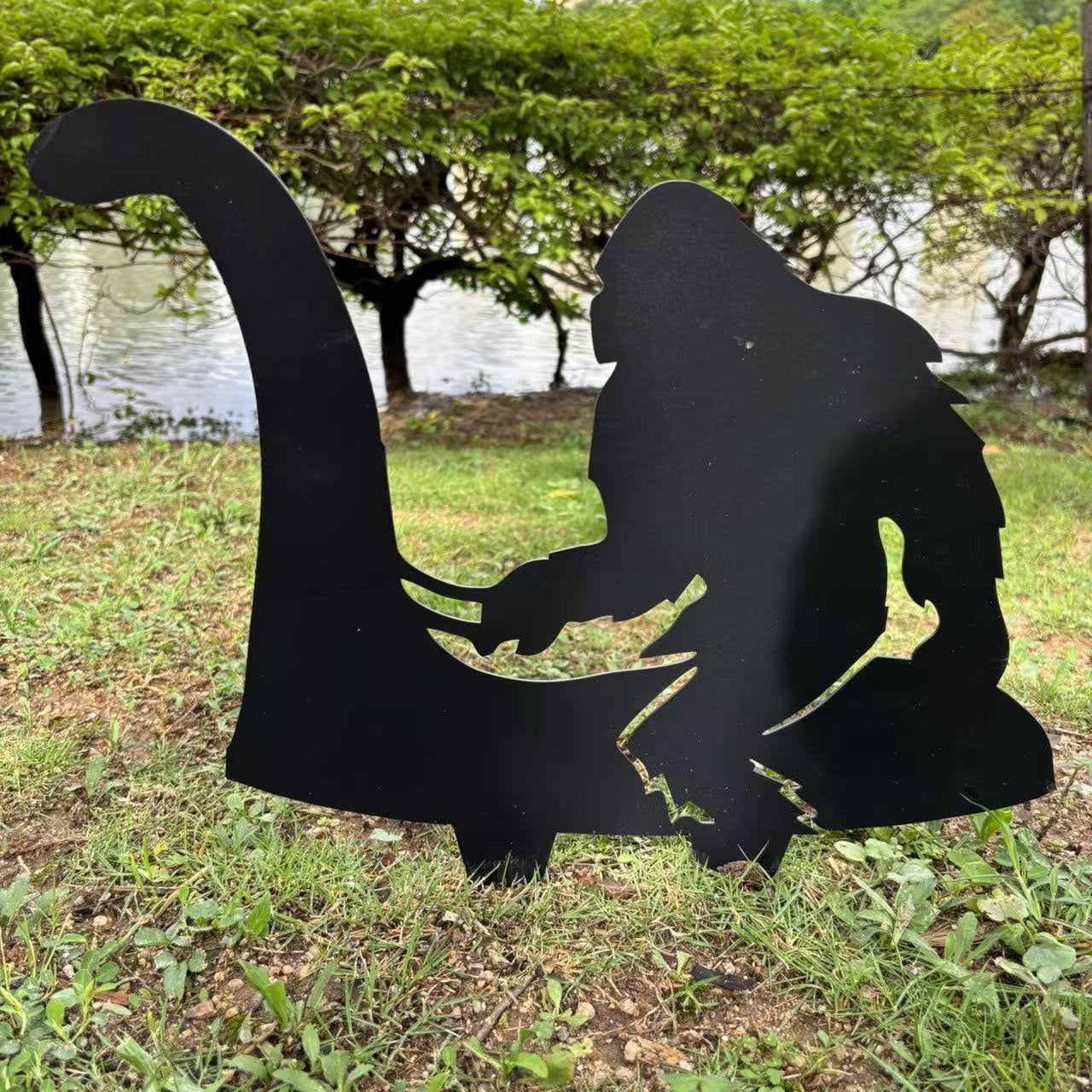 Bigfoot riding Loch Ness Monster metal art