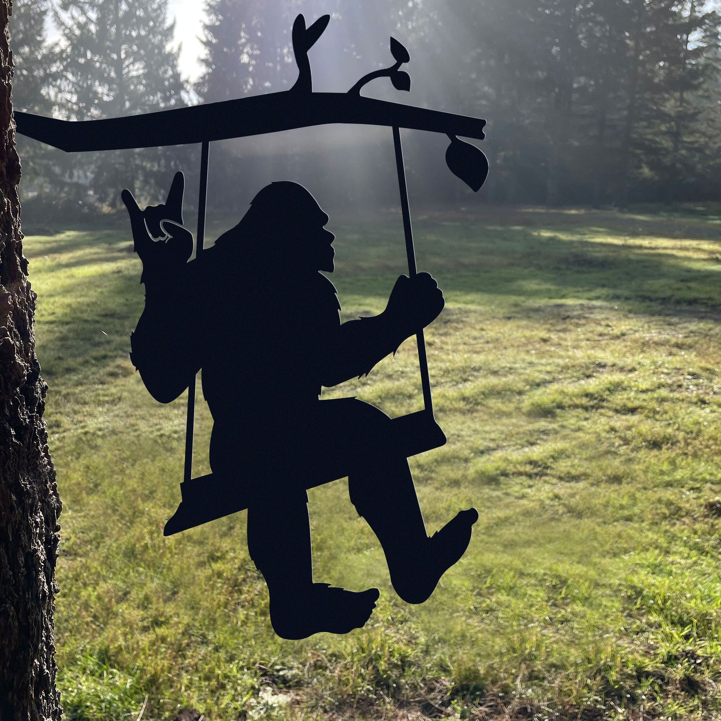 Bigfoot metal art on a swing