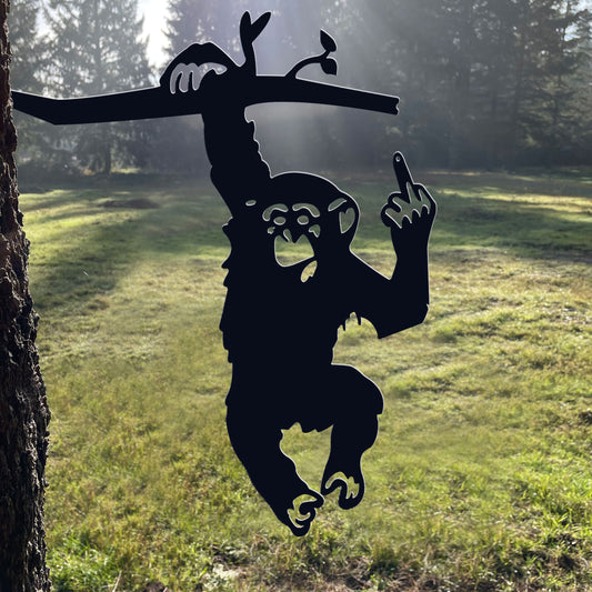 Metal of a monkey with the middle finger raised