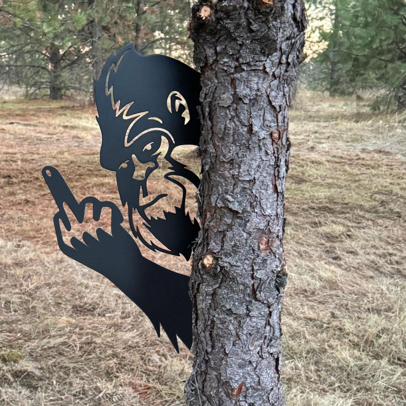 Bigfoot metal art showing middle finger