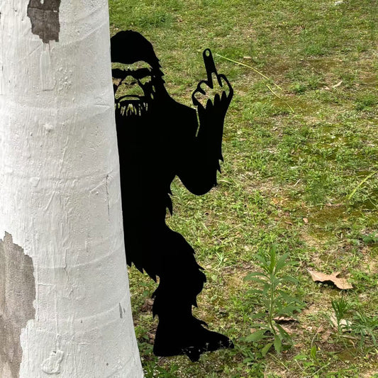 Bigfoot metal art showing middle finger