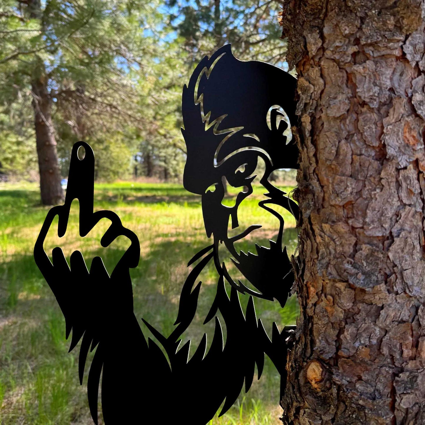 Bigfoot metal art showing middle finger